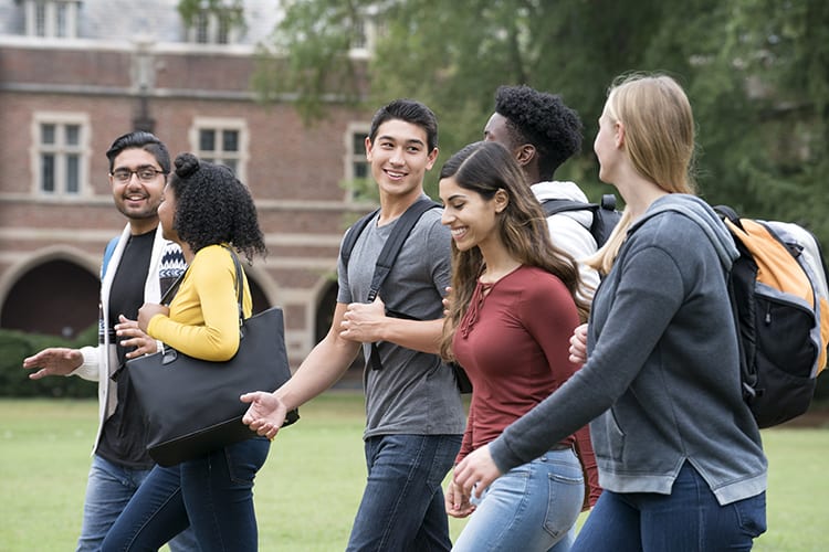 Diverse Group of University Students Walking on Campus