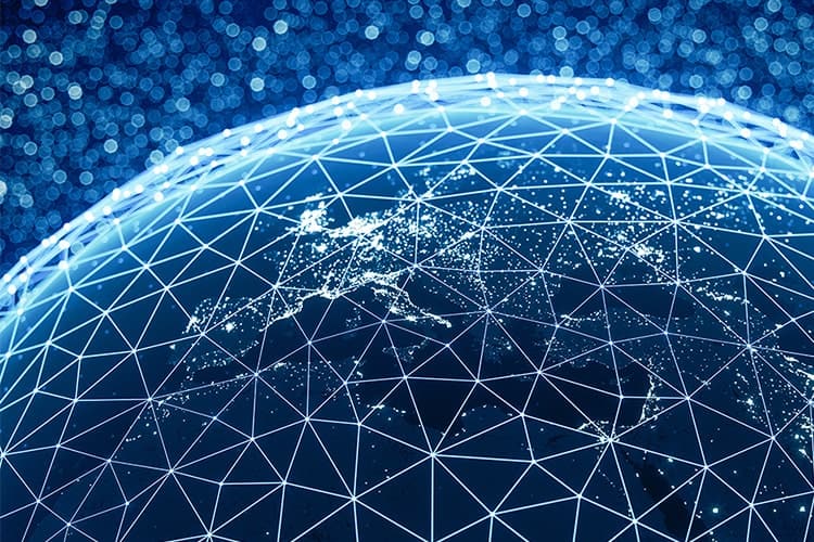 The image shows a digital representation of a globe, with a network of interconnected lines forming a geometric web over the Earth’s surface. The lines are illuminated with bright points, representing nodes or connections across continents, indicating the flow of data or information. The background is filled with blue and white lights, creating a sense of depth and a futuristic atmosphere. This image symbolizes global connectivity, digital networks, and technological integration, potentially in the context of financial systems, international communication, or the ISO 20022 messaging standard for global payments.