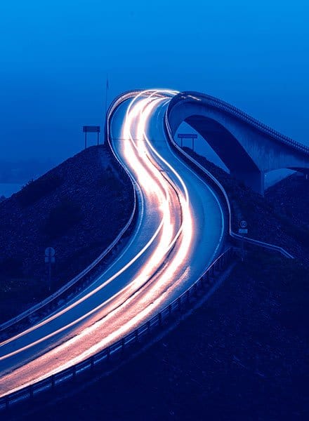 Bridge over land with car light motion blur