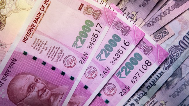 A close up photo of Indian currency