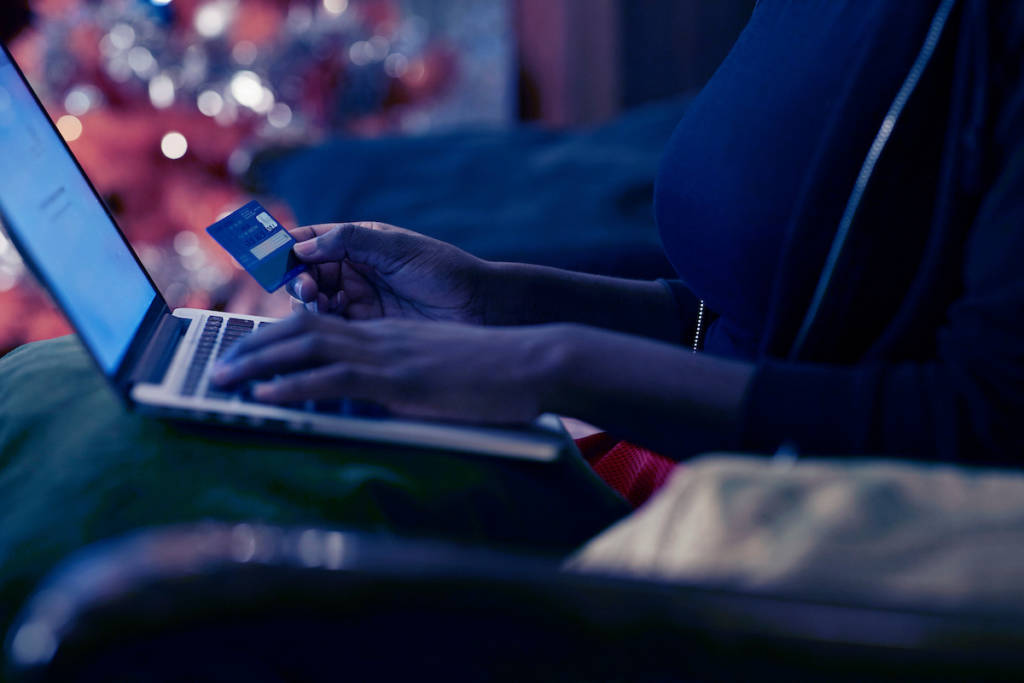 Young woman ordering Christmas gifts online