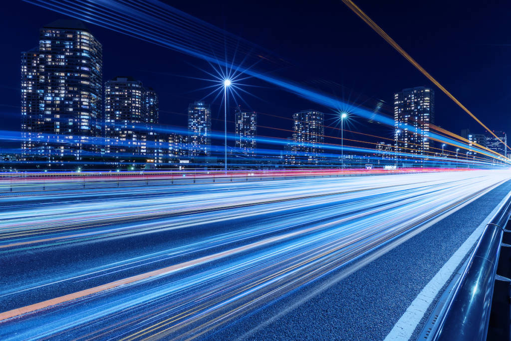 Cityscape Against Clear Sky And Light Trails At Night