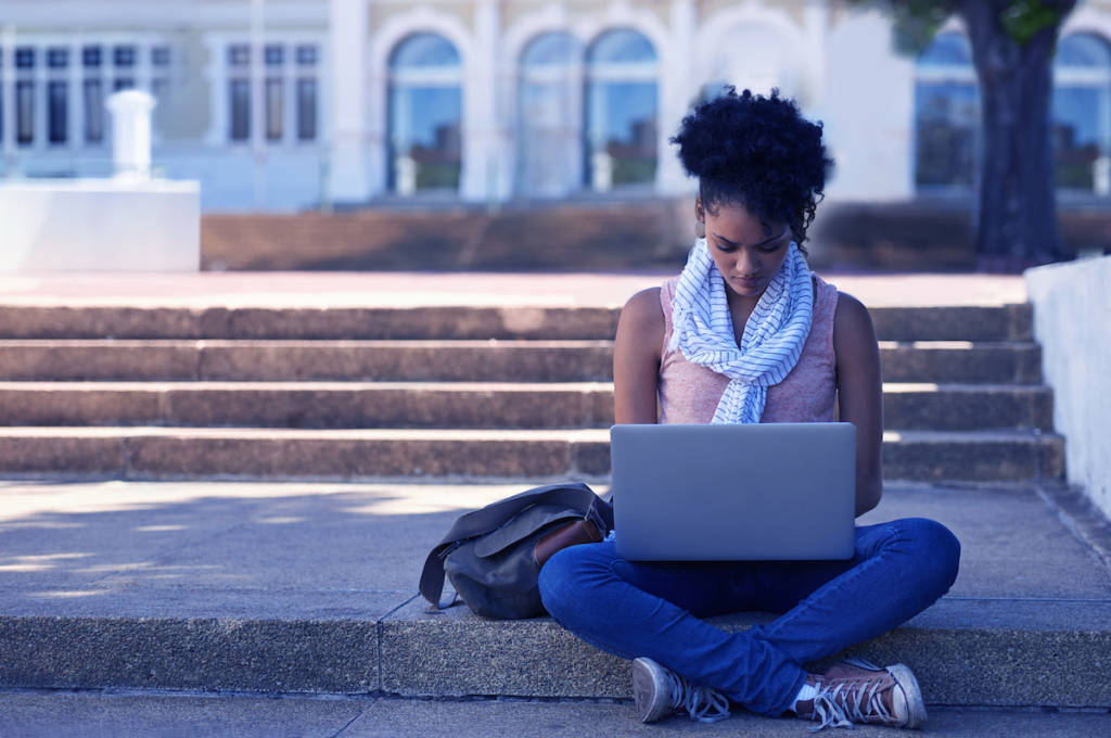 women sitting on steps