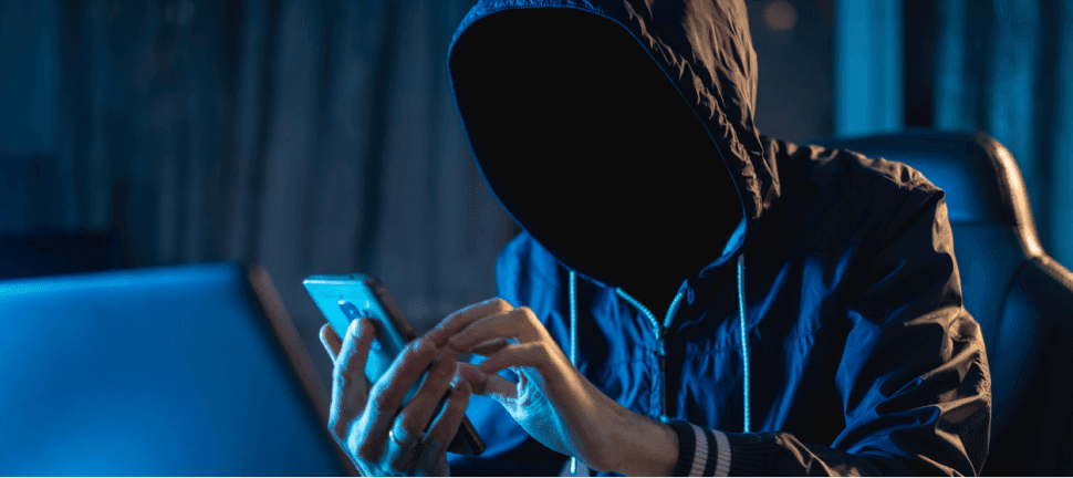 ID theft hacker with phone.